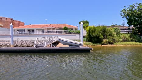 inflatable boat approaches dock on sunny day