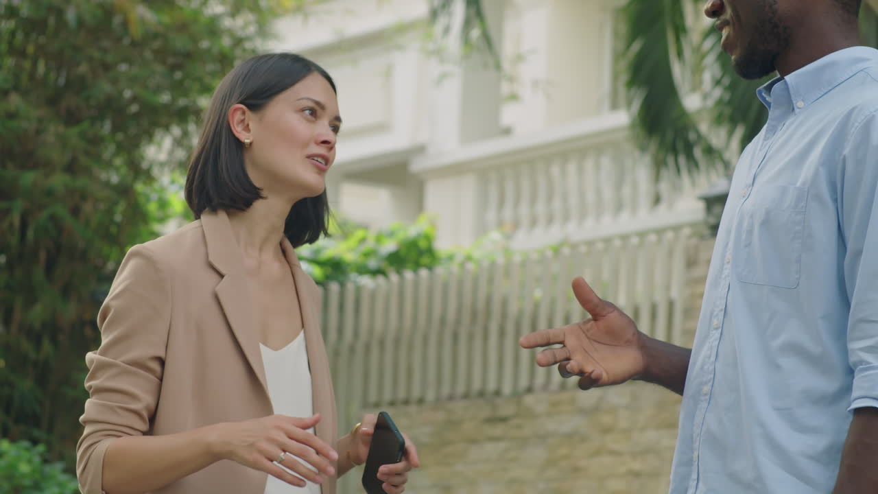 Diverse Colleagues Talking Outdoors on Street