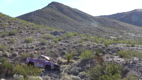 An-abandoned-pickup-truck-sits-rusting-in-the-Mojave-Desert