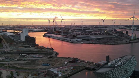 aerial hyperlapse during sunset with wind turbines and river