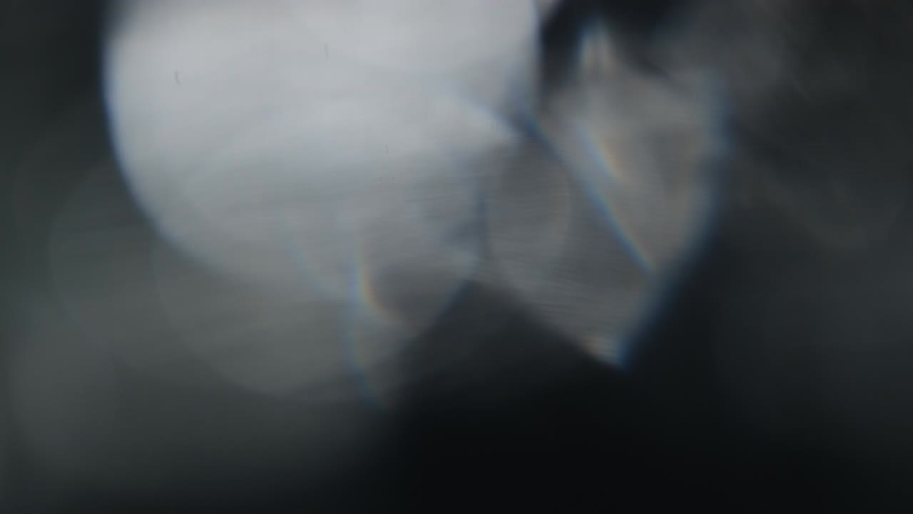 Abstract light leaks on black background.