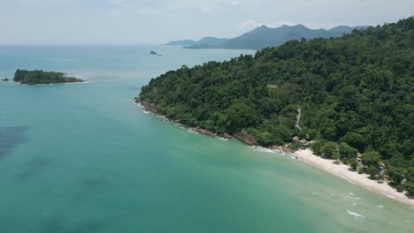 aerial scenic nature drone footage of the mountains and beaches on the tropical island of koh chang in thailand on a sunny day