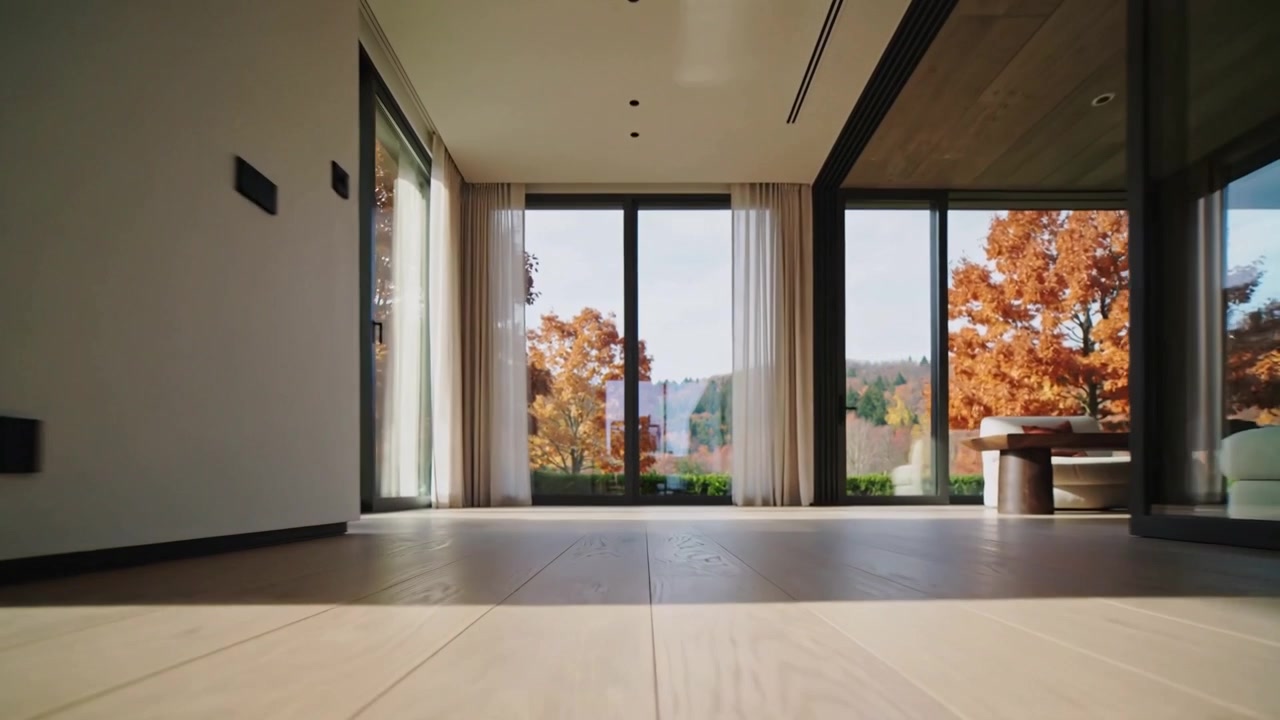 Pushing camera forward revealing hardwood floor and sofa with orange throw in living room