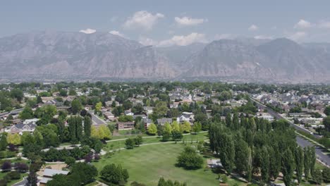 orem and provo residential region with wasatch mountains in background, aerial