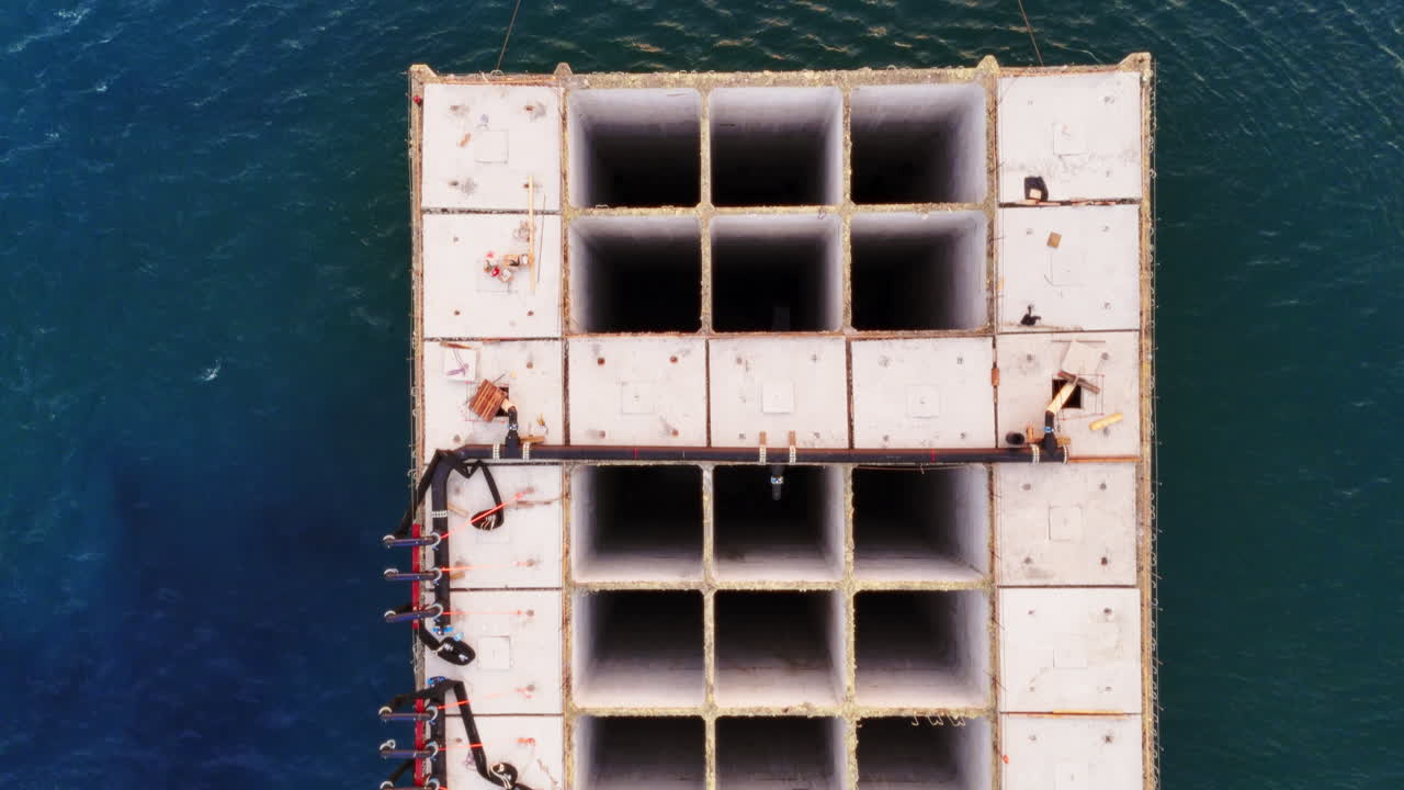 Aerial top down view of a concrete structure to build in the sea