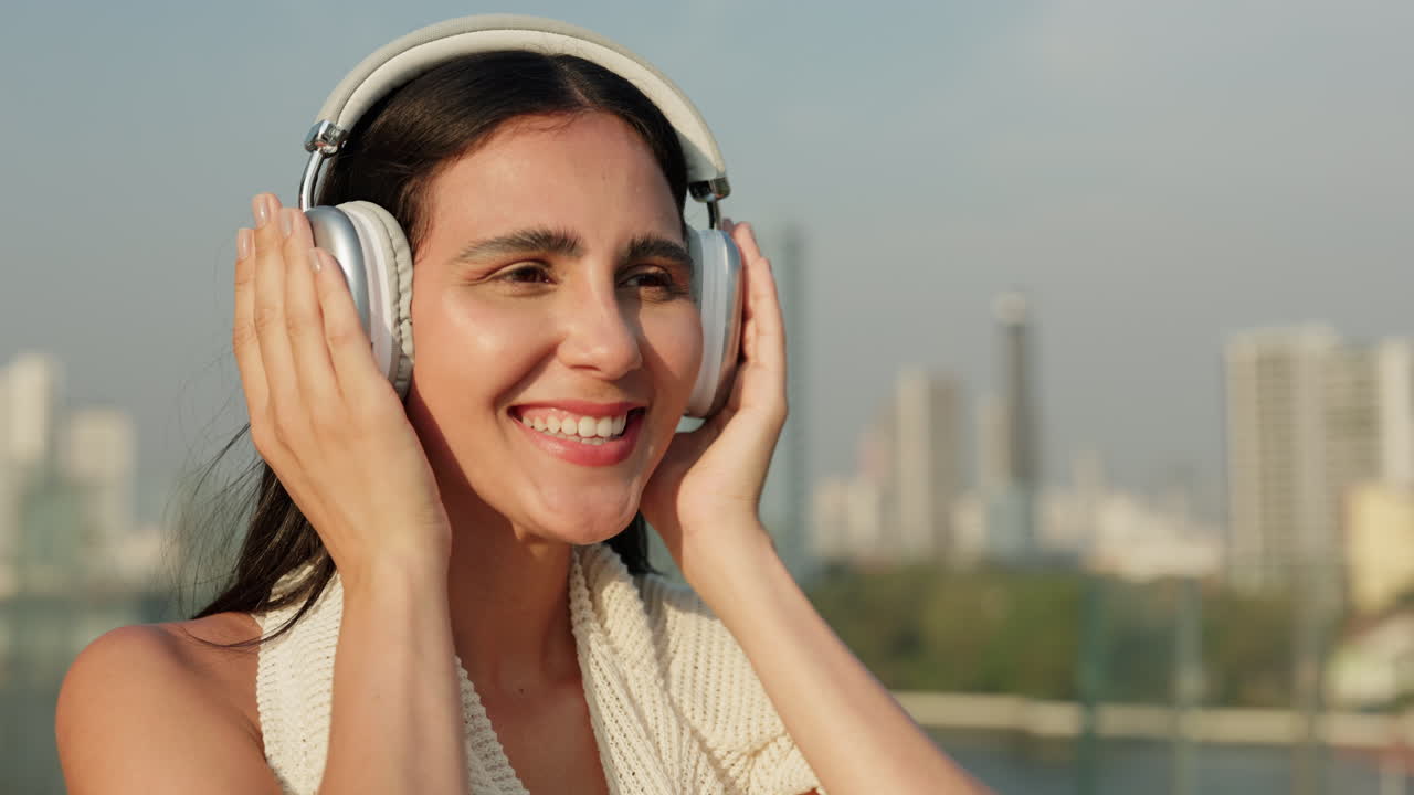 Woman Enjoying Music with Headphones in the City