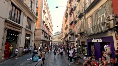 people walking through a bustling alley