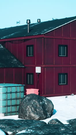 a red building in a snowy landscape