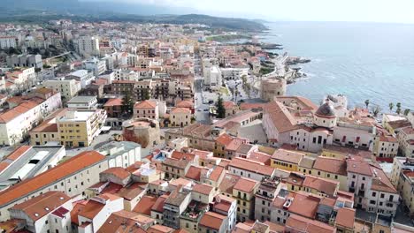 aerial shot over alghero old town, sardinia, with cityscape view on a beautiful clear day