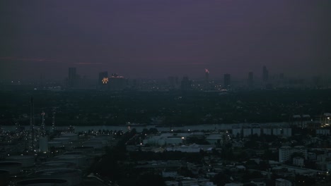 dusk sets over bangkok's urban expanse with a pink sky gradient