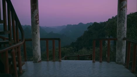 buddhist temple balcony view of a pink sunset in vietnam