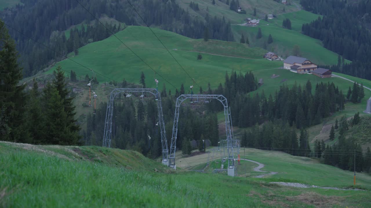 ski slope in summer, green field.