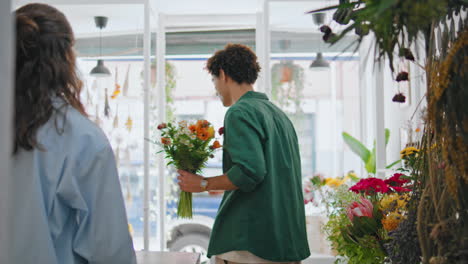 happy buyer purchase flowers bouquet composition in plant shop. sale concept.