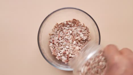 pouring dried rice/nuts into a bowl