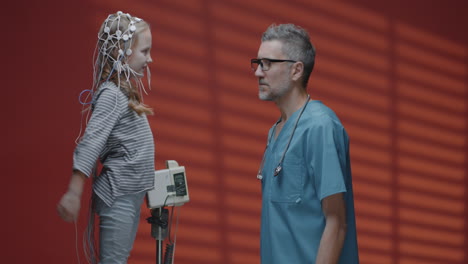 child undergoing eeg test with doctor