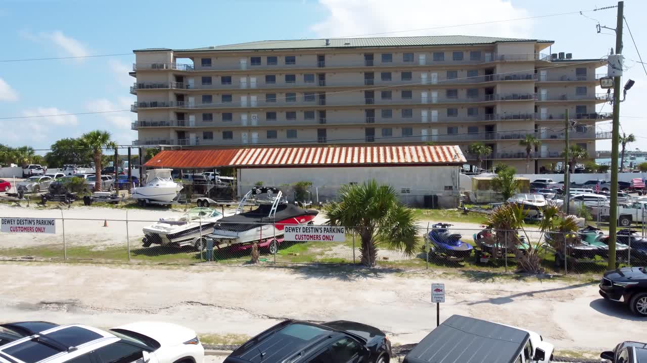 Beachfront Condo Building with Parking Lot and Boats