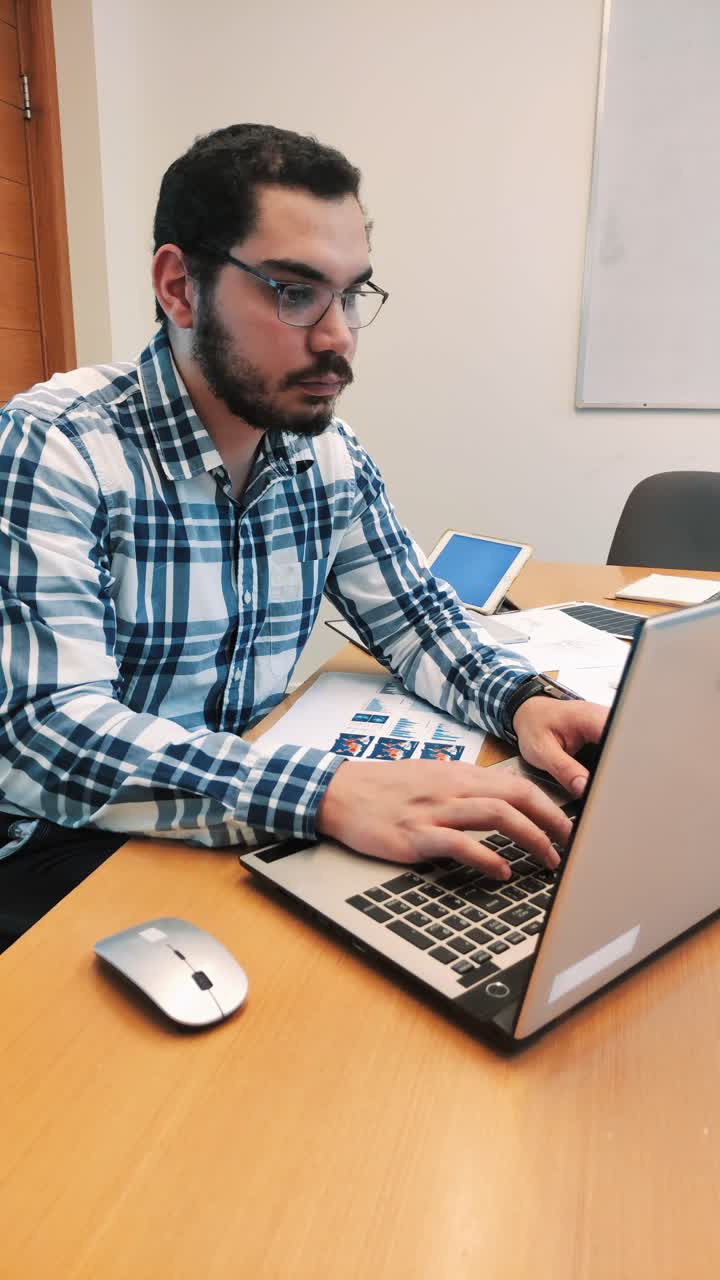 Pensive Designer Contemplating a Project at His Laptop
