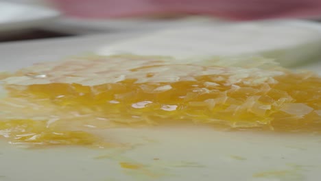 honeycomb on plate with cream cheese