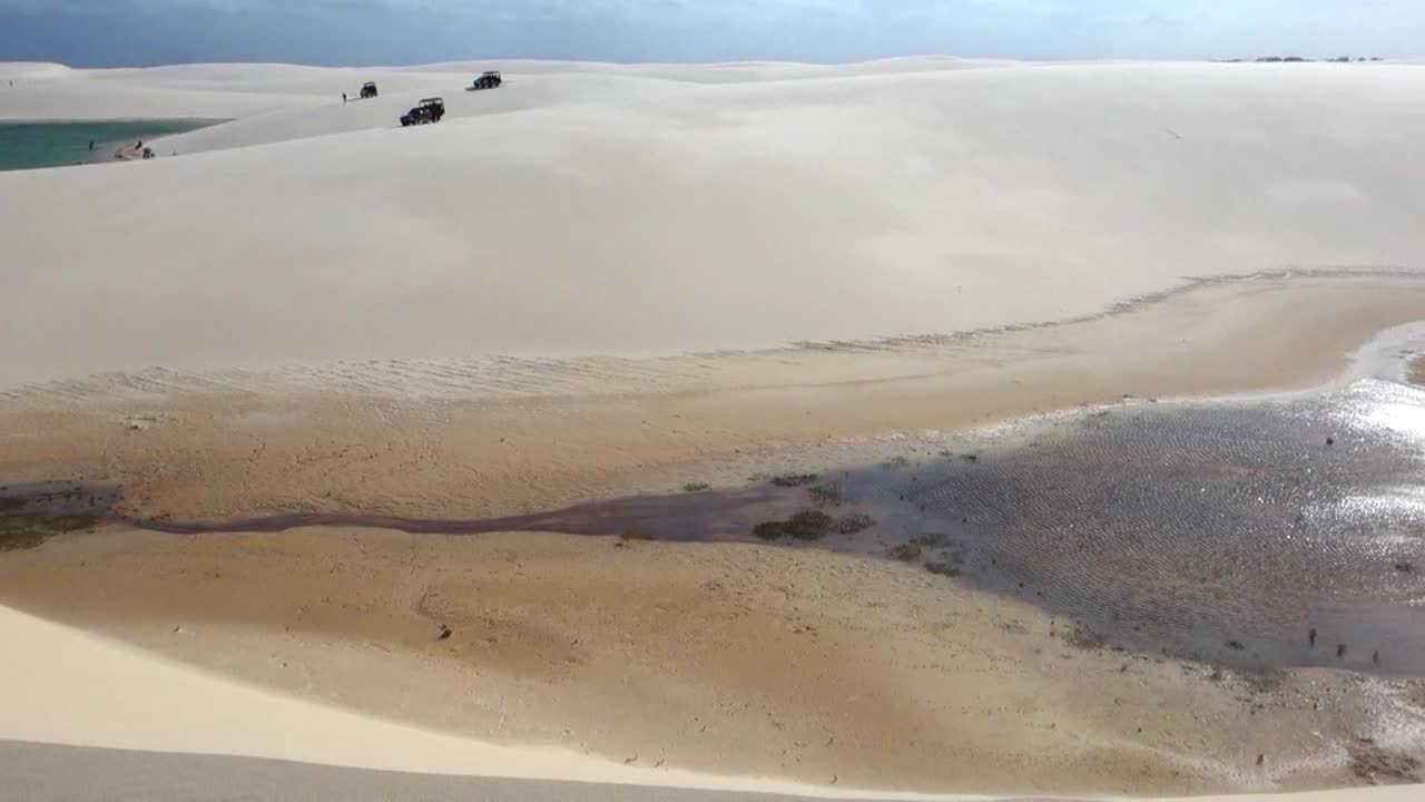 View of dunes and rainwater lakes at Lençóis Maranhenses National Park, Barreirinhas, Maranhão, Brazil Northeast Coast.Outdoor beach scenery. Tropical climate
