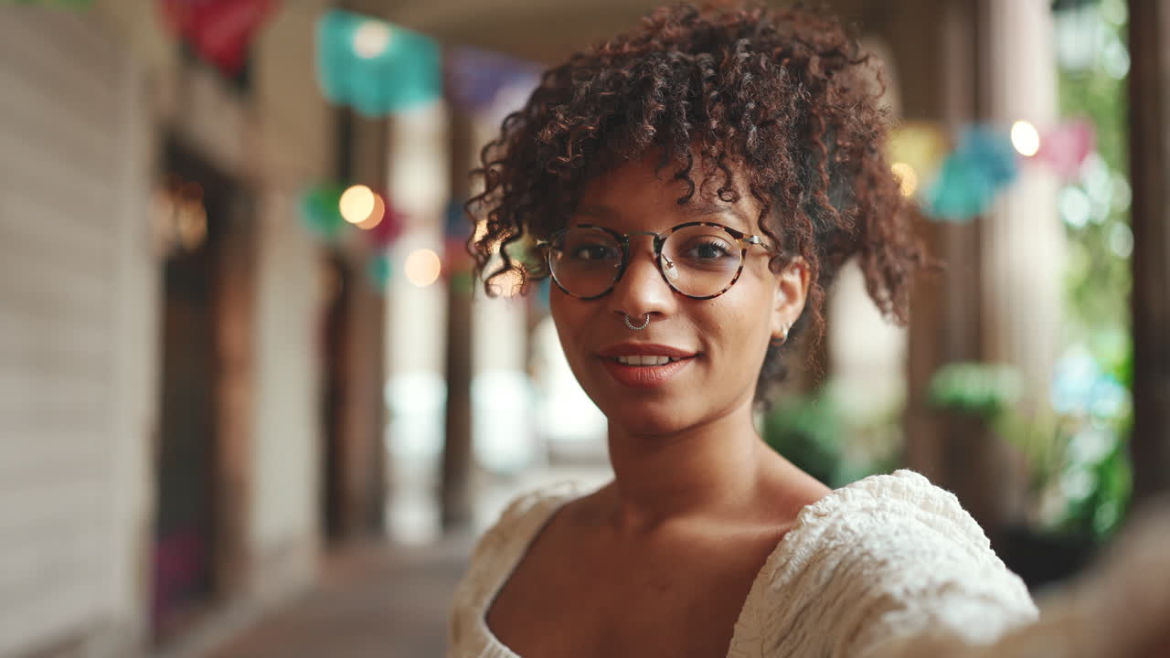 Woman with curly hair takes a selfie