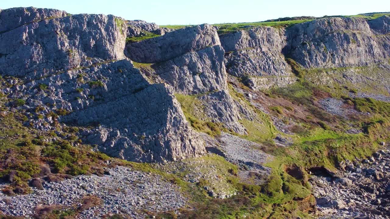 Aerial Drone View of Multiple Cliffs Along Eroding Gower Coast in South Wales, UK. Dramatic Scenic Natural Rock Formations