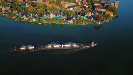 boat carrying fuel tanks in zaanse schans - boats in river zaan