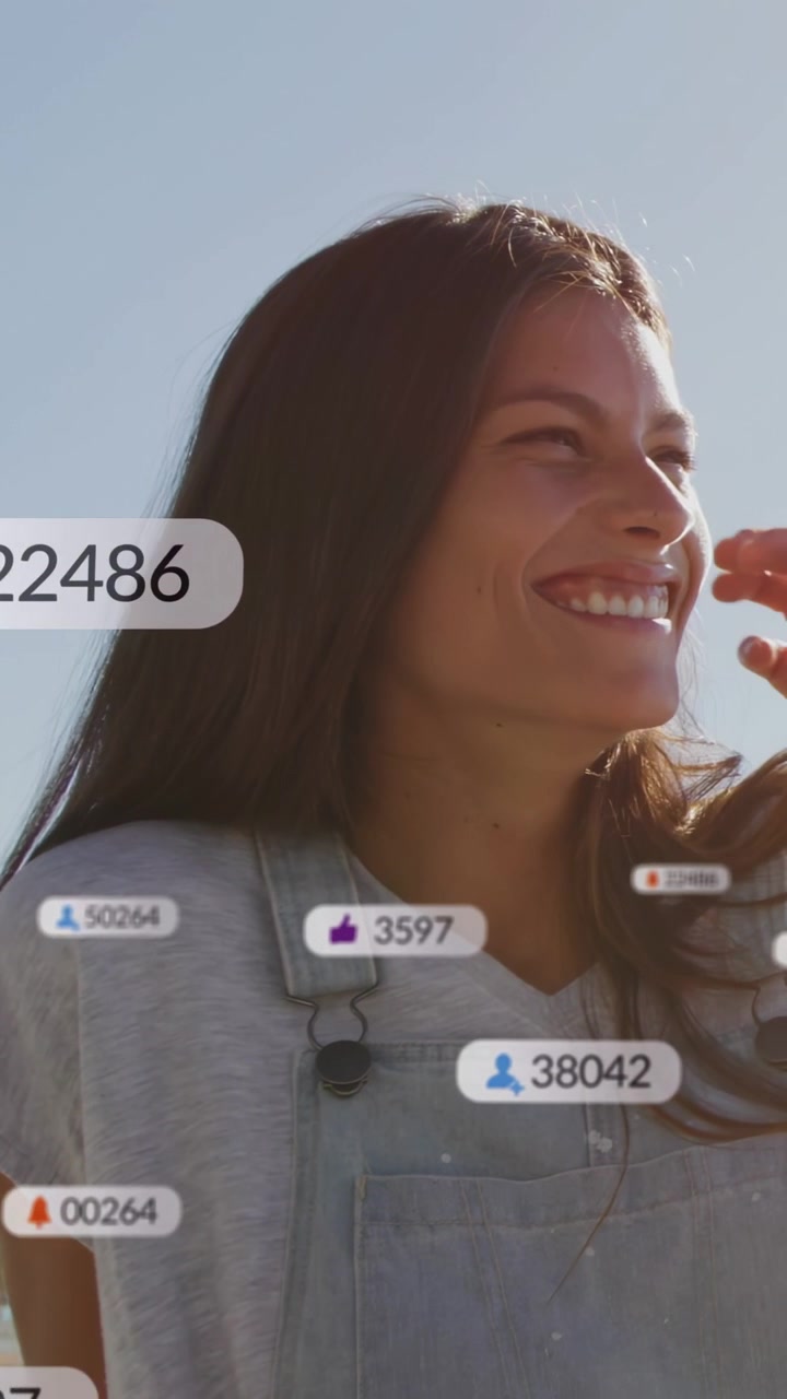 Vertical video: Woman turning tucking hair as social alerts showing engagement badges fading
