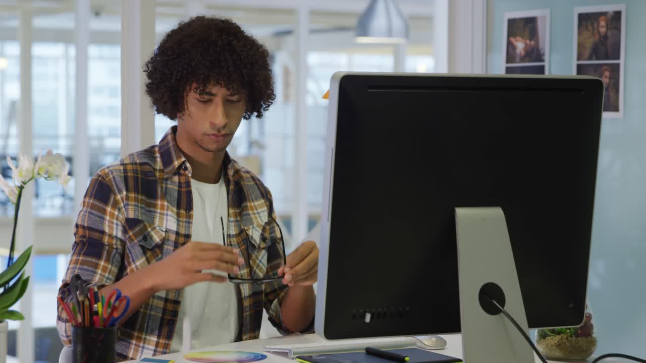 Young man working in a creative office