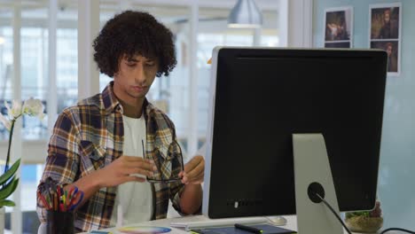 young man working in a creative office