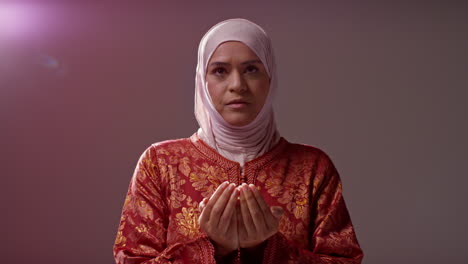 Studio-Head-And-Shoulders-Portrait-Of-Muslim-Woman-Wearing-Hijab-Praying-9