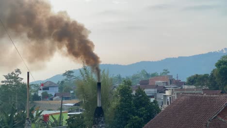 black smoke coming out from industrial chimney