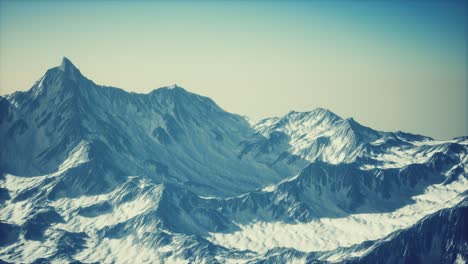 aerial view of the alps mountains in snow
