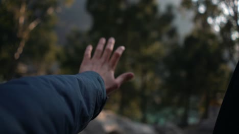 slo-mo hand arm forearm view outside car window of mountains himachal in india cinematic