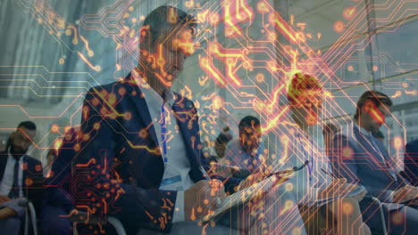 In meeting, business professionals discussing technology integration with digital circuit animation