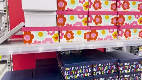 various gift boxes arranged on store shelves