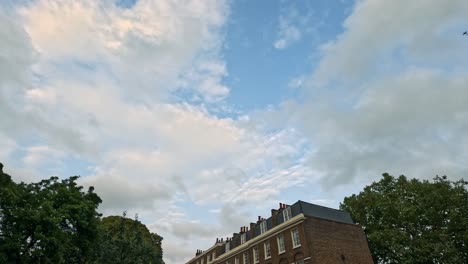 cloudy sky over historic london street scene