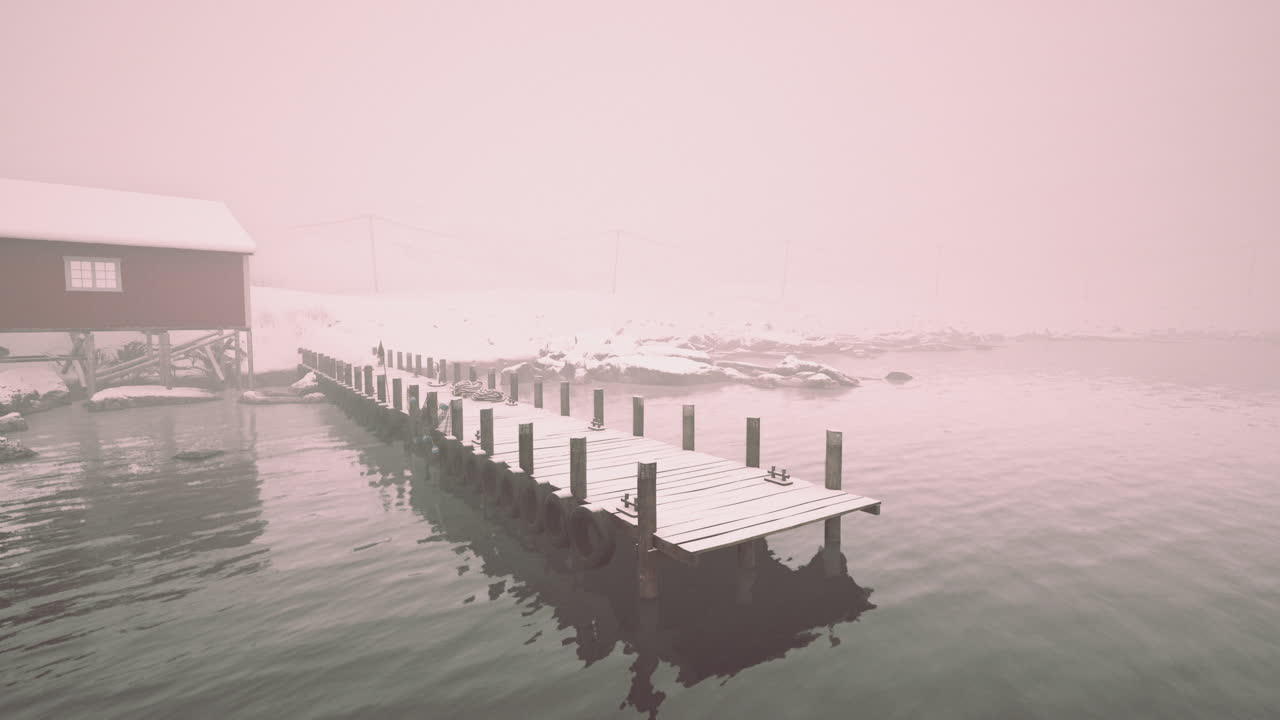Misty Winter Scene with a Wooden Pier and Red Cabin