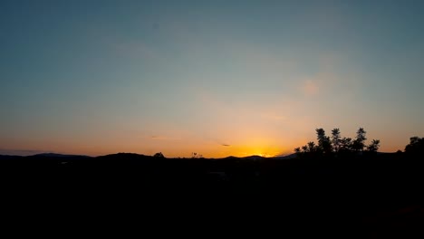 Mountain-Silhouette-Backlit-Golden-Sunlight-Near-Village-In-Valencia,-Spain-During-Dusk