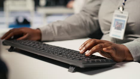 vertical video close up of data center admin coding, writing script on pc