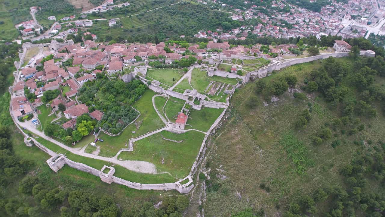 Berat Castle on hill in Albania, aerial scenic view of historic landmark and tourist attraction.