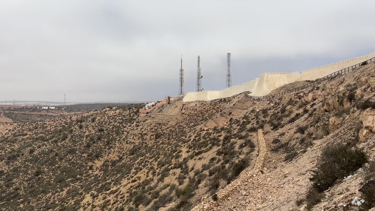 Desert Hillside with Wall and Towers