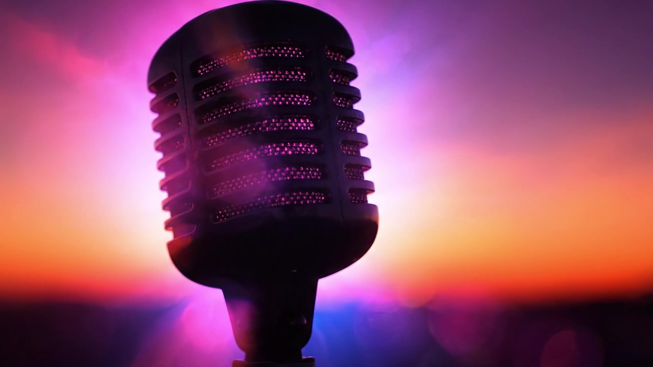 A Stunning Silhouette of a Vintage Microphone Against a Beautiful, Colorful Sunset Sky, Capturing the Essence of Music and Creativity