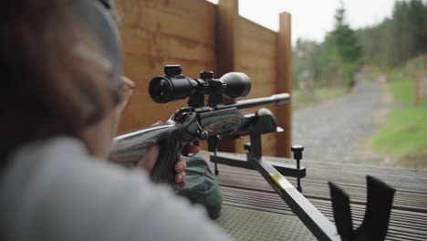 Safety-first-as-young-woman-wears-glasses-and-ear-defenders-when-shooting