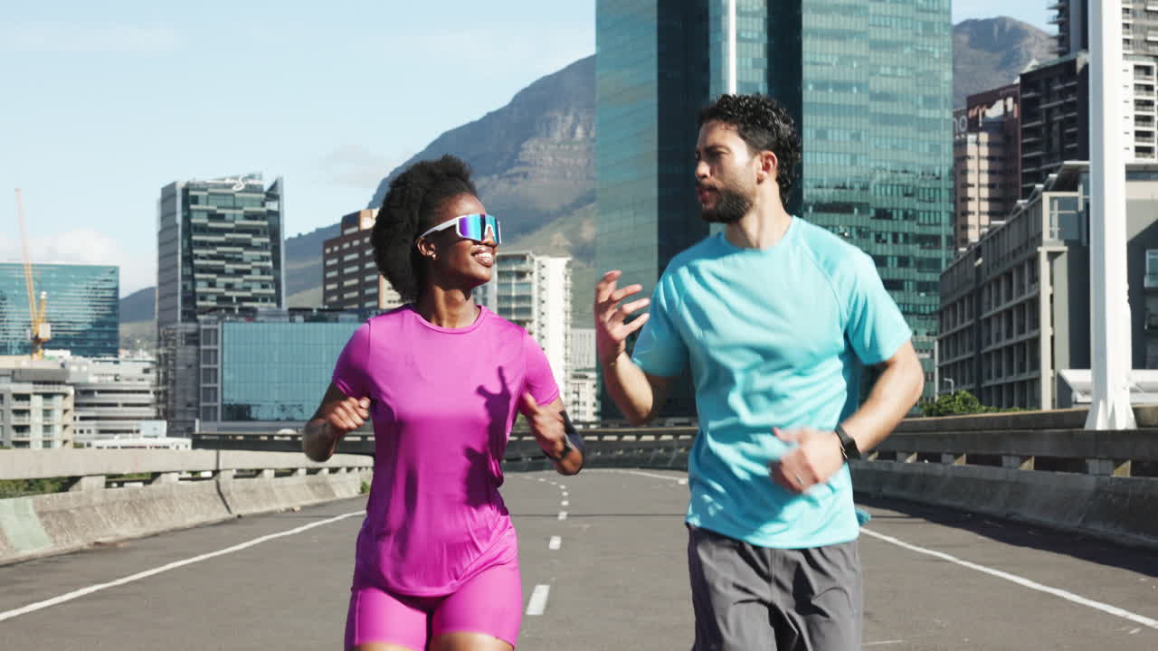Man and Woman Jogging Together on an Urban Road