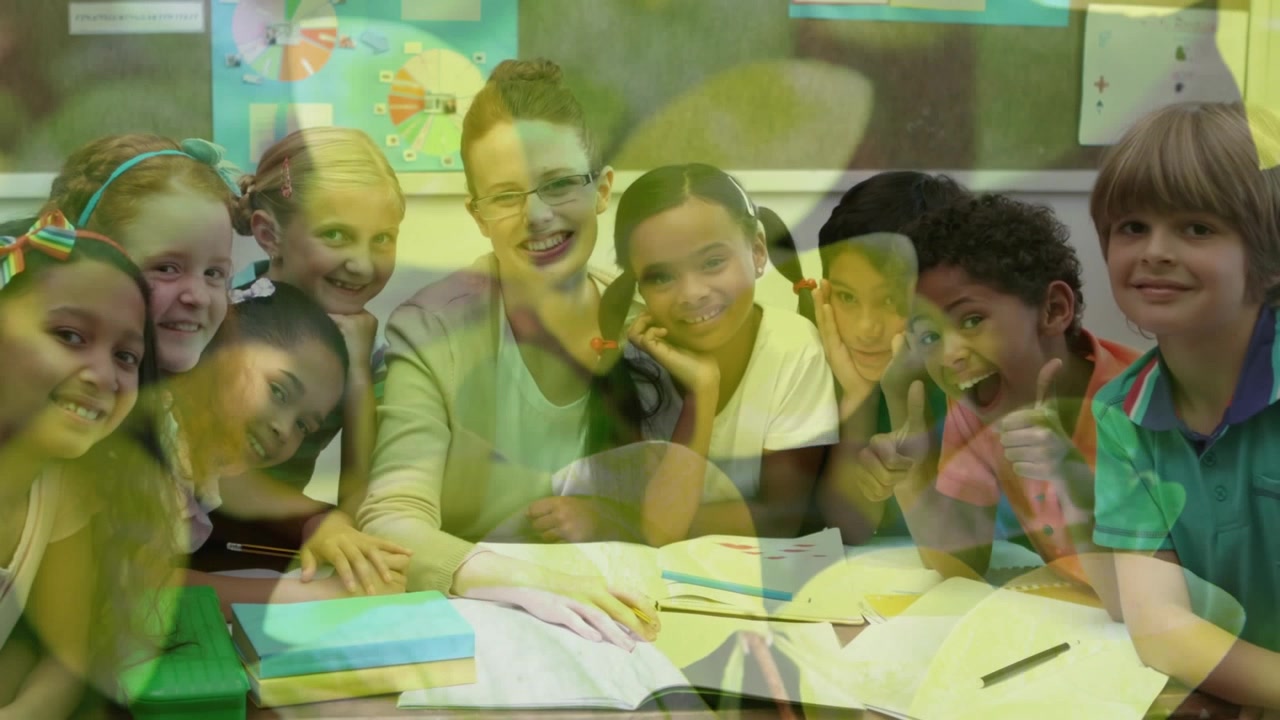 Animation of leaves over diverse schoolchildren and teacher