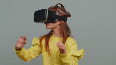 Child-kid-girl-using-headset-helmet-app-to-play-simulation-game,-watching-virtual-reality-3D-video