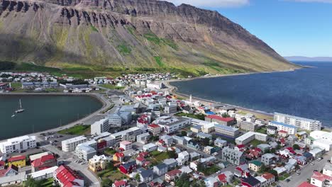 Aerial-View-of-Isafjordur,-Town-and-Fjord-on-Sunny-Day-in-Landscape-of-Iceland