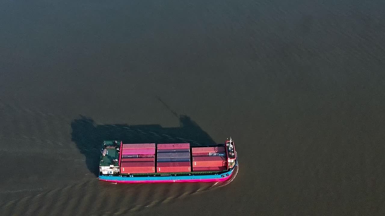 Container ship sails along the river near Bangkok in Thailand