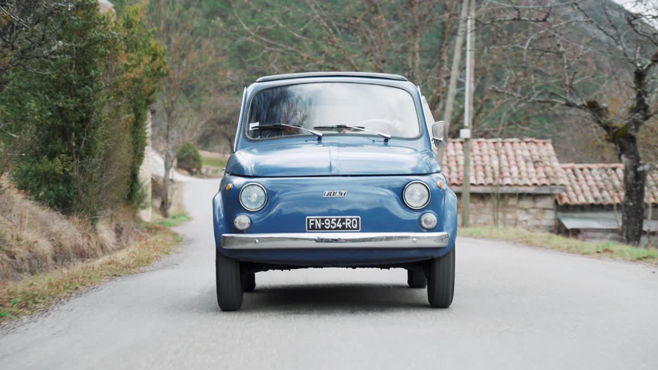 Couple on a Road Trip in a Classic Fiat 500