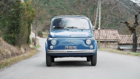 couple on a road trip in a classic fiat 500